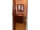 This bathroom features a single vanity, a toilet, and a medicine cabinet for storage at 12720 Jan St, San Antonio, FL 33576