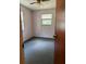 This bedroom has neutral walls, carpeted floors, a window with blinds, and a ceiling fan at 12720 Jan St, San Antonio, FL 33576