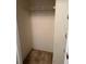 Small walk-in closet with a shelf and a hanging rod at 12720 Jan St, San Antonio, FL 33576