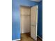 A small closet with one shelf and a bi-fold door at 12720 Jan St, San Antonio, FL 33576