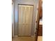 A view of a hall closet, with folding doors, showing convenient storage space at 12720 Jan St, San Antonio, FL 33576