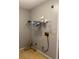 Functional laundry room with shelf storage and washer and dryer hookups at 12720 Jan St, San Antonio, FL 33576