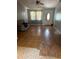 A view of the room with a ceiling fan, furniture, flooring, and a front door at 12720 Jan St, San Antonio, FL 33576