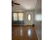 A view of the room with a ceiling fan, flooring, and a front door at 12720 Jan St, San Antonio, FL 33576