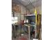 Organized shed featuring a workbench with storage and tools at 12720 Jan St, San Antonio, FL 33576