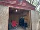 A view inside the shed featuring a red camping chair and toolbox at 12720 Jan St, San Antonio, FL 33576
