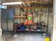 Shed interior showcasing a workbench with tools and a blue cabinet at 12720 Jan St, San Antonio, FL 33576