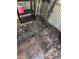 Shed interior with a black shelf and miscellaneous items on the floor at 12720 Jan St, San Antonio, FL 33576