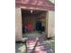 The shed has plywood walls, a red chair, a wooden ramp, and space to pursue your hobby at 12720 Jan St, San Antonio, FL 33576