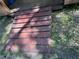 Red wooden walkway leading up to an outdoor shed at 12720 Jan St, San Antonio, FL 33576