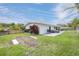 Large backyard with well-maintained lawn and patio, perfect for outdoor gatherings at 1322 Byron Dr, Clearwater, FL 33756