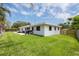 Enjoy the expansive lawn and outdoor patio with ample space for entertaining at 1322 Byron Dr, Clearwater, FL 33756