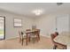 Cozy dining area with natural light, tile flooring, and a view into the kitchen at 1322 Byron Dr, Clearwater, FL 33756