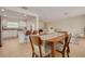 Bright dining area adjoining the kitchen and living room, featuring tile floors and modern furnishings at 1322 Byron Dr, Clearwater, FL 33756