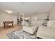 Open living space combining living, dining, and kitchen areas with tile floors and modern decor at 1322 Byron Dr, Clearwater, FL 33756