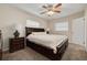 Spacious main bedroom with a ceiling fan and ensuite bathroom at 1322 Byron Dr, Clearwater, FL 33756