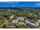 Aerial view of the community featuring multiple buildings, lush green spaces, and a pool at 1400 Gandy N Blvd # 1705, St Petersburg, FL 33702