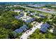 Community aerial view featuring a swimming pool, tennis courts, and highway access at 1400 Gandy N Blvd # 1705, St Petersburg, FL 33702