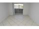Living area with a sliding glass door out to the balcony at 1400 Gandy N Blvd # 1705, St Petersburg, FL 33702