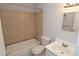 Standard bathroom featuring a tiled shower-tub combo, toilet, and single-sink vanity at 1400 Gandy N Blvd # 1705, St Petersburg, FL 33702