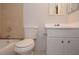 Standard bathroom featuring a tiled shower-tub combo, toilet, and single-sink vanity at 1400 Gandy N Blvd # 1705, St Petersburg, FL 33702