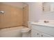 Standard bathroom featuring a tiled shower-tub combo, toilet, and single-sink vanity at 1400 Gandy N Blvd # 1705, St Petersburg, FL 33702