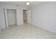Bright bedroom features neutral paint, closet, and tile floors at 1400 Gandy N Blvd # 1705, St Petersburg, FL 33702
