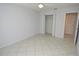 Empty bedroom features tile flooring, a ceiling fan, and a closet at 1400 Gandy N Blvd # 1705, St Petersburg, FL 33702