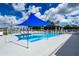 Sparkling community pool with a shaded lounge area perfect for hot summer days at 1400 Gandy N Blvd # 1705, St Petersburg, FL 33702