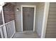 Inviting entrance featuring a solid neutral-colored door, brick accents, and secure keyed entry at 1400 Gandy N Blvd # 1705, St Petersburg, FL 33702