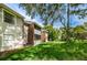 Exterior view of backyard with lawn and brick accents at 1400 Gandy N Blvd # 1705, St Petersburg, FL 33702