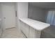 Open kitchen area with breakfast bar connecting to a bright living space at 1400 Gandy N Blvd # 1705, St Petersburg, FL 33702