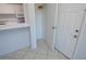Bright, efficient kitchen with white cabinets, breakfast bar, and essential appliances at 1400 Gandy N Blvd # 1705, St Petersburg, FL 33702