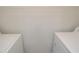 Dedicated laundry space with washer and dryer hookups and overhead shelving at 1400 Gandy N Blvd # 1705, St Petersburg, FL 33702