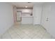 Well-lit open floor plan with ceramic tile, blending living and kitchen areas seamlessly at 1400 Gandy N Blvd # 1705, St Petersburg, FL 33702