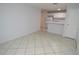 Bright living room features neutral decor, tile floors, and flows into the kitchen at 1400 Gandy N Blvd # 1705, St Petersburg, FL 33702