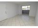 Comfortable living area with sliding glass doors and neutral tile flooring at 1400 Gandy N Blvd # 1705, St Petersburg, FL 33702