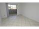 Living area with a sliding glass door out to the balcony at 1400 Gandy N Blvd # 1705, St Petersburg, FL 33702