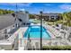 Overhead view of the community pool area with pool, hot tub, lounge chairs and well-maintained landscaping at 1400 Gandy N Blvd # 1705, St Petersburg, FL 33702