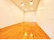 Indoor racquetball court featuring hardwood floors and white brick walls for a clean aesthetic at 1400 Gandy N Blvd # 1705, St Petersburg, FL 33702