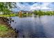 Scenic water view of the condo complex's lake with fountain and lush green landscape at 1400 Gandy N Blvd # 1705, St Petersburg, FL 33702