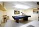 Finished basement with pool table offers a great space for entertaining guests at 14409 Curley Rd, Dade City, FL 33525