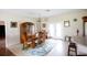 Open dining room with tile floors, pendant lighting and a glass slider out to the backyard at 14409 Curley Rd, Dade City, FL 33525