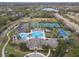 Aerial view featuring the community center, pool, tennis courts, and basketball court at 14634 Mirasol Manor Ct, Tampa, FL 33626