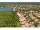 Aerial view of a neighborhood, homes, and community lakes in a suburban setting at 14634 Mirasol Manor Ct, Tampa, FL 33626