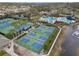 Aerial view of community pickleball and tennis courts located near the pool at 14634 Mirasol Manor Ct, Tampa, FL 33626