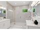 Bathroom with double vanity, glass shower, and modern fixtures at 14634 Mirasol Manor Ct, Tampa, FL 33626