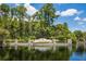 Waterchase community entrance with water feature and mature trees at 14634 Mirasol Manor Ct, Tampa, FL 33626