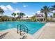 An inviting community pool area surrounded by lush landscaping and comfortable lounge chairs at 14634 Mirasol Manor Ct, Tampa, FL 33626