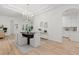 Dining room with wood floors, modern light fixture and lots of natural light at 14634 Mirasol Manor Ct, Tampa, FL 33626